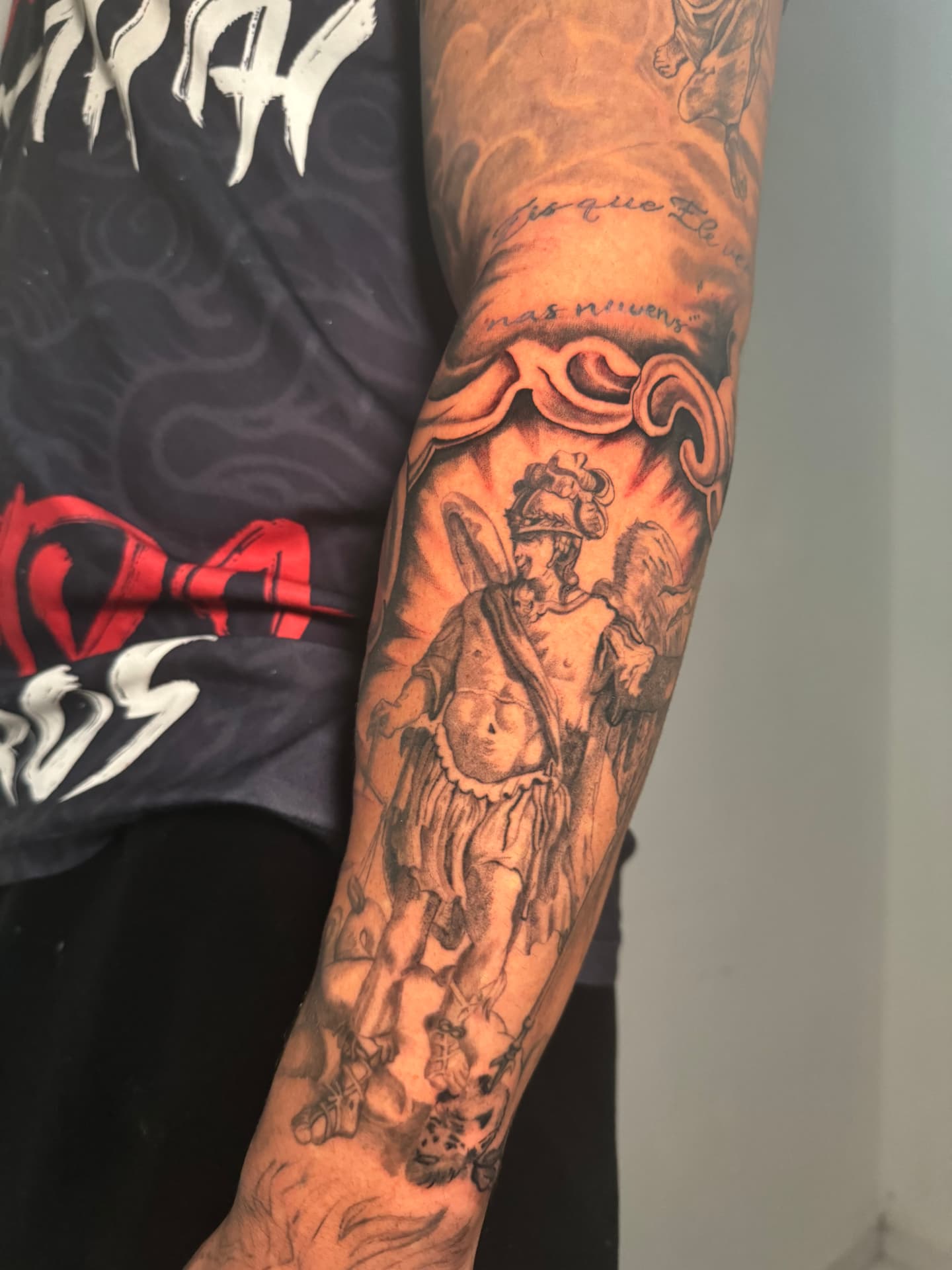 St. Michael half sleeve freshly worked on a client's arm